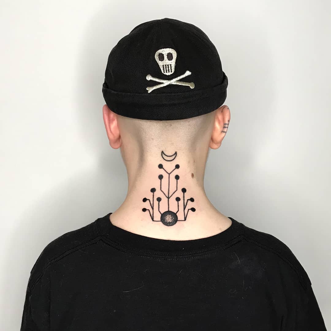 Back neck tattoo with a small geometric design and minimalist circuit elements